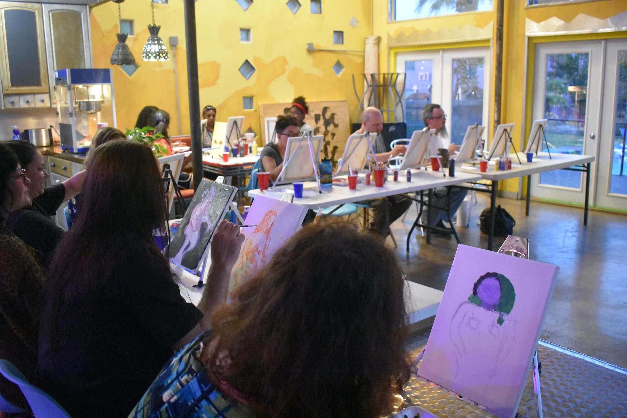 A full painting class in the club at Metropolis Apartments