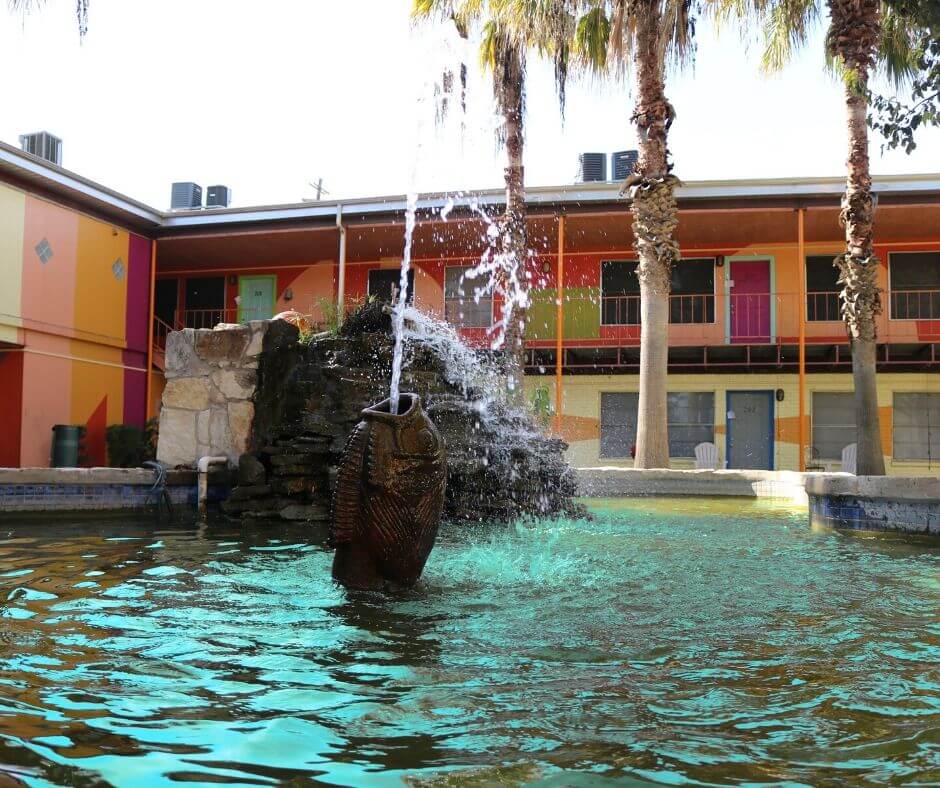 The fish water fountain at The Metropolis Apartments